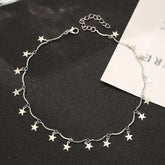 A silver-plated star choker necklace with small stars linked together, adding a whimsical touch to any outfit.